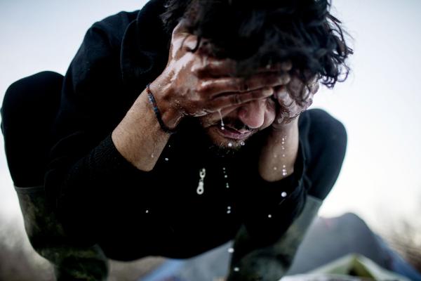 Image from Stranded - Bihac/Bosnia-Herzegovina - A refugee from Afghanistan, washes his face. he and...
