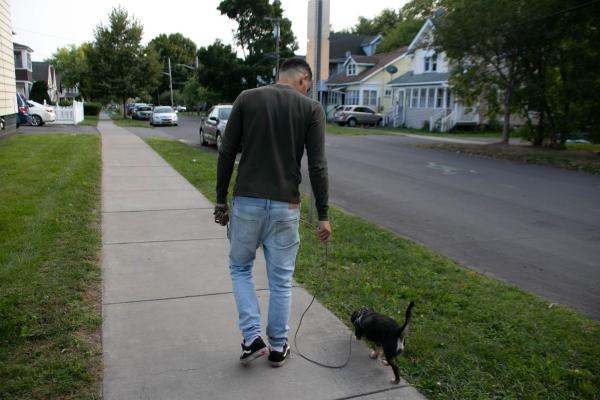 The Daily Orange - Angel Gonzales walks through his neighborhood with his dog talking about the nature of the...
