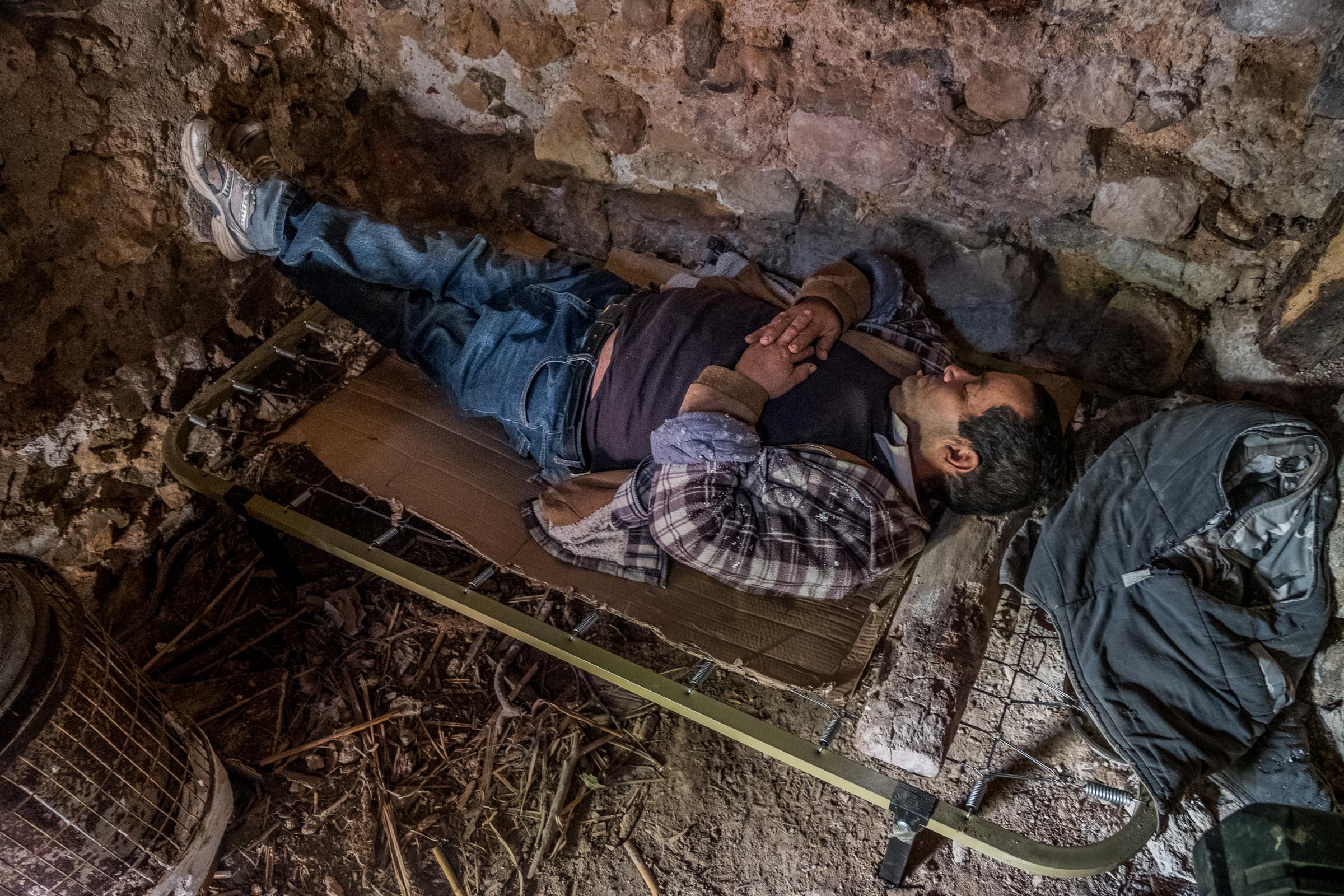 Rutopia - Spain - Felix Franco Escobar is taking a nap in the ruin he is...