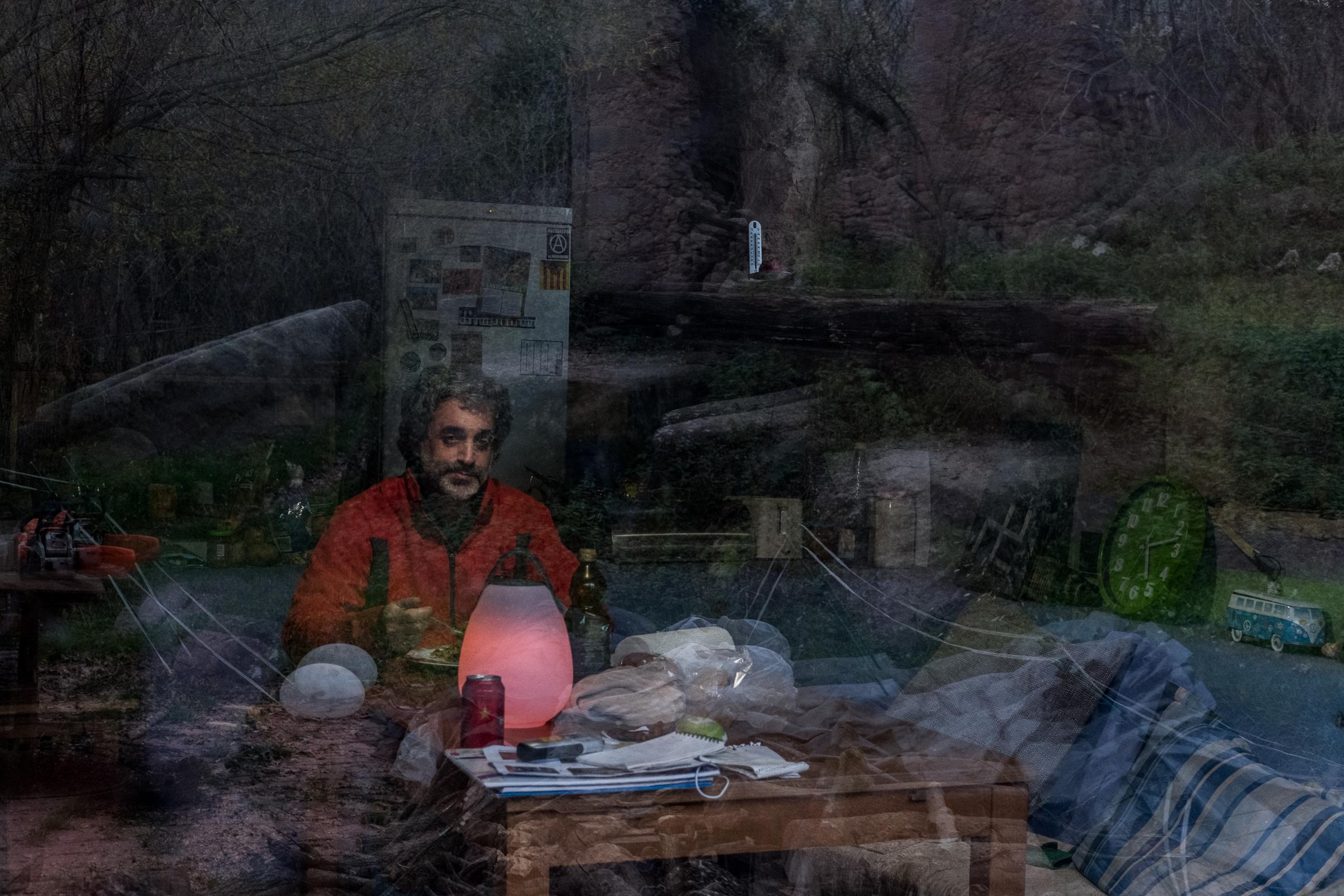 Rutopia - Spain - Didac Costa sits alone in his house, while the...