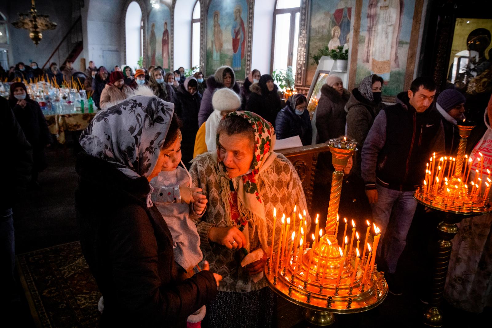 People attend holy liturgy on E...ity of Taraklia. Moldova, 2021.
