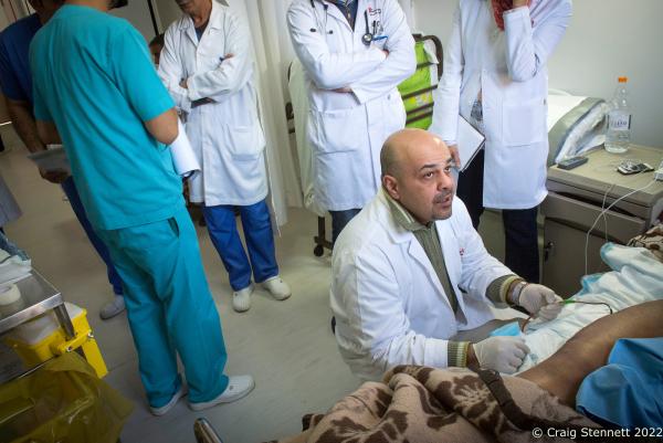 AMMAN, JORDAN-JANUARY 13: Dr Ali AlAni examines a patient on his ward rounds post surgery accompanied by his surgical team at the MSF (M&eacute;decins Sans Fronti&egrave;res/Doctors Without Borders) Hospital for Reconstructive Surgery in Amman, Jordan on January 13th, 2016. MSF opened the Al Mowasah Hospital in Tirmizi Street, Amman on the 8th September 2015. It is the first fully-fledged medical facility devoted solely to reconstructive surgery, physiotherapy and psychological support for victims of war. The Hospital is unique in offering a comprehensive care package free for its patients. It is the societies biggest single annual financial commitment with an expense of approximately &pound;7.5 million per year (2016) and a departure from its classical solely disaster response role towards one that offers &quot;rebuilding lives&quot;. (Photo by Craig Stennett/Getty Images)