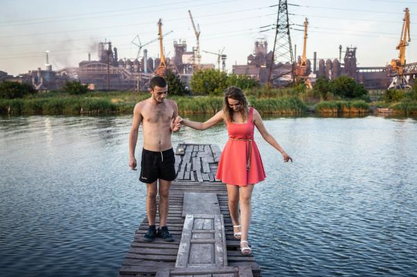 Image from Donbas War and Peace - Young couple having a date on the bank of Kalmius river...