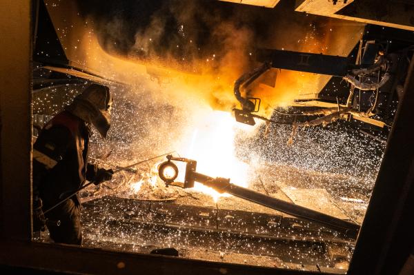 Image from Donbas War and Peace - A worker operates the continuous-casting machine at the...