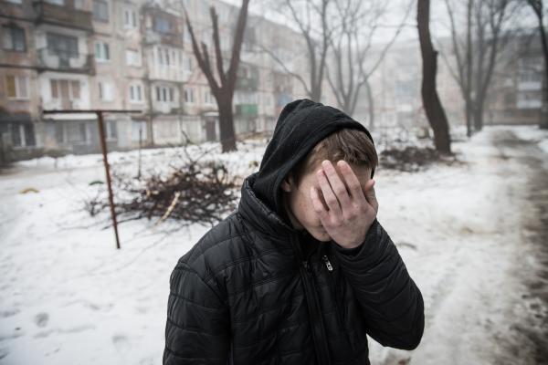 Image from Donbas War and Peace - Vova, 17, showing his yard ruined by one of the few...