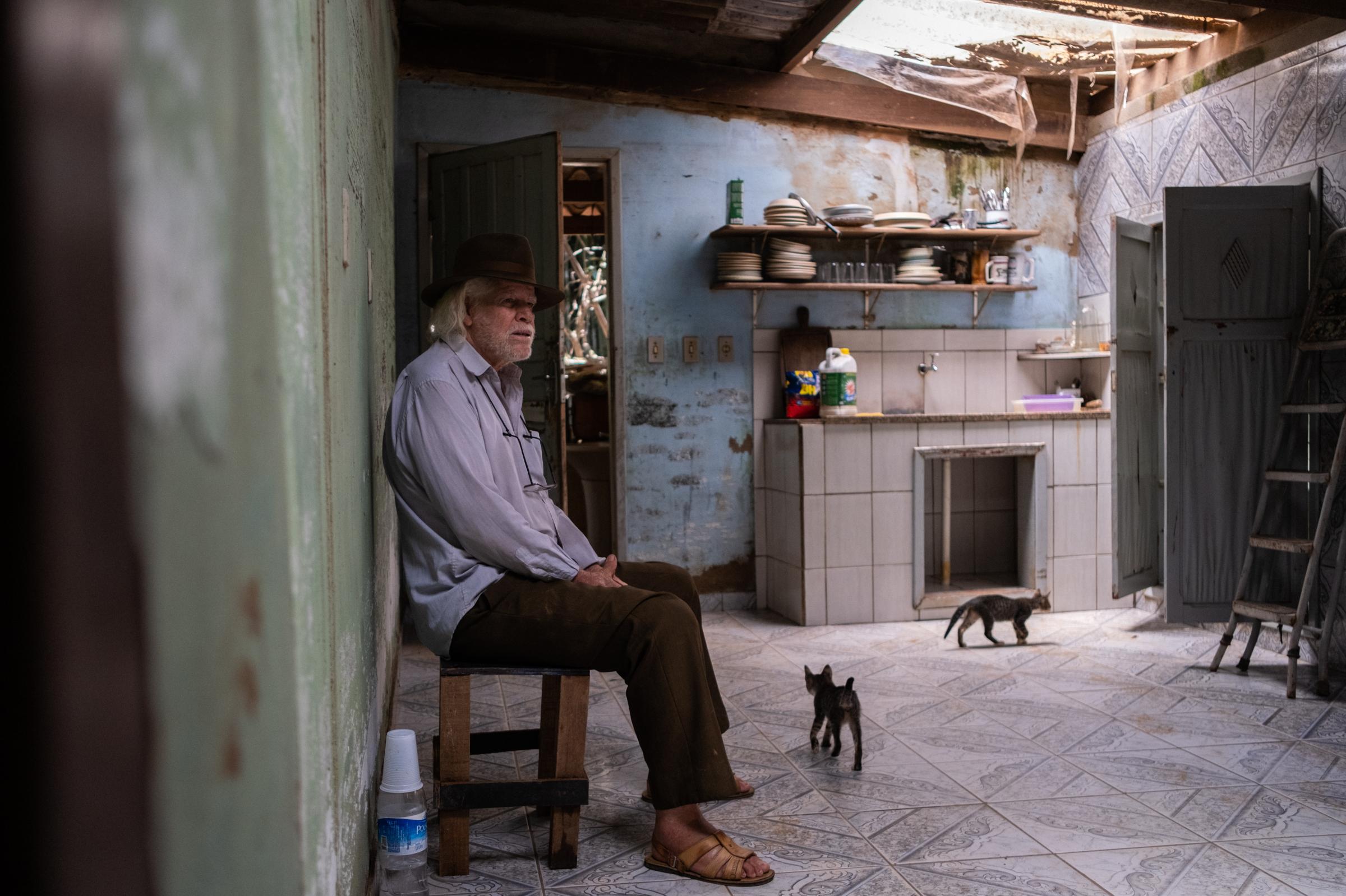 Three Years Later: Deadly Mining Disaster Still Tests Vale and Mining Towns Live in Fear of Another Dam Collapse - Avelino Oliveira Junior, 88, returns to his home to clean up after having to evacuate with his...