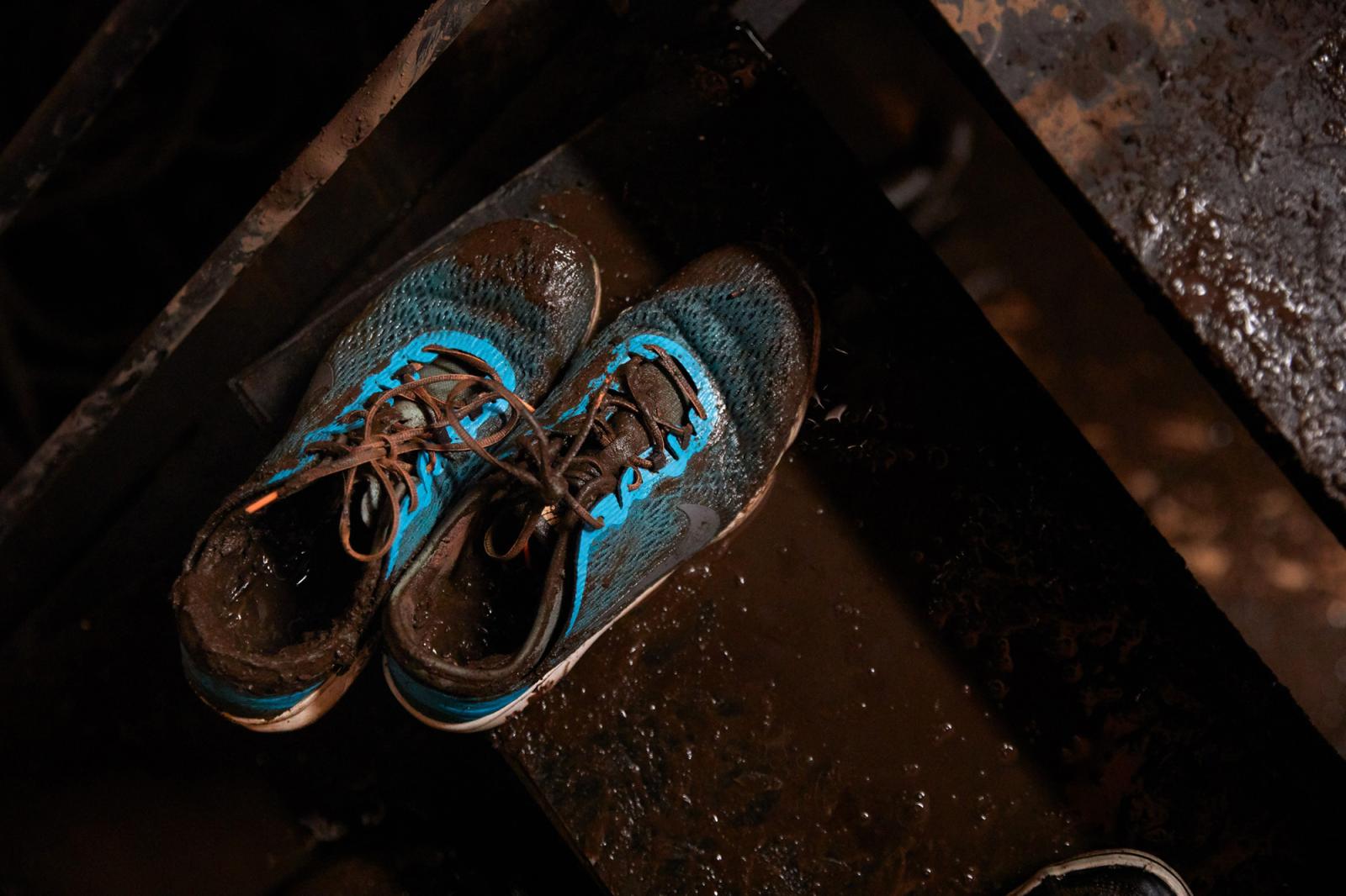 Detail of muddy shoes after a m...Ecuador, Tuesday, Feb. 1, 2022.