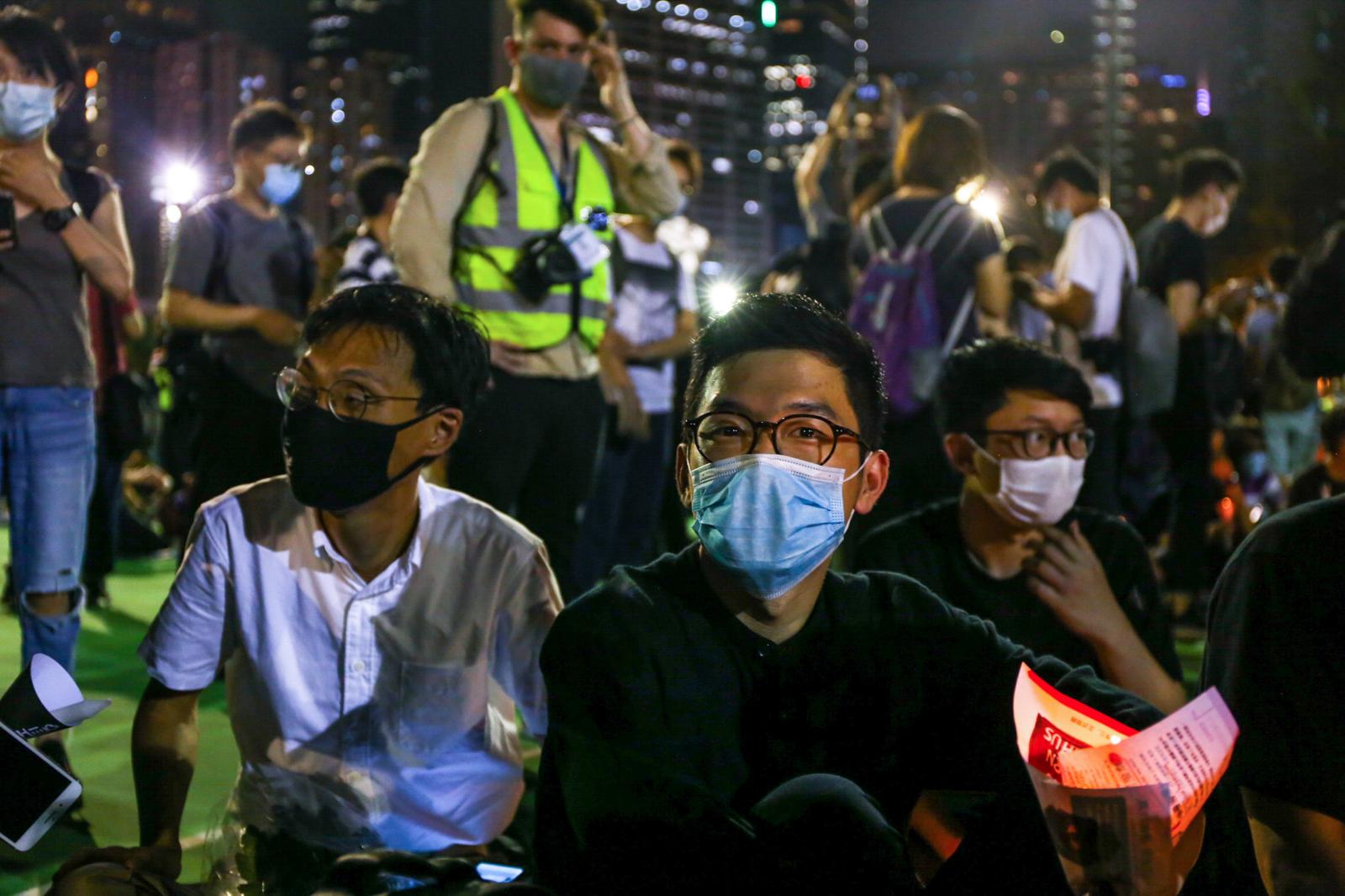 High-profile activists Nathan Law and former-Legislative Council member Eddie Chu sit casually during a candelit vigil to commemorate the Tiananmen Square massacre. Banned for the first time in 30 years, there are speculations that the vigil has already taken place for the last time. Up until now, Hong Kong was the only territory in China that allowed the commemoration to take place. In the months to follow, Law would go into exile and Chu would be arrested on multiple occasions for charges under the National Security Law, a piece of legislation imposed by Beijing that would ban all forms of dissent and would be punishable by life in prison.