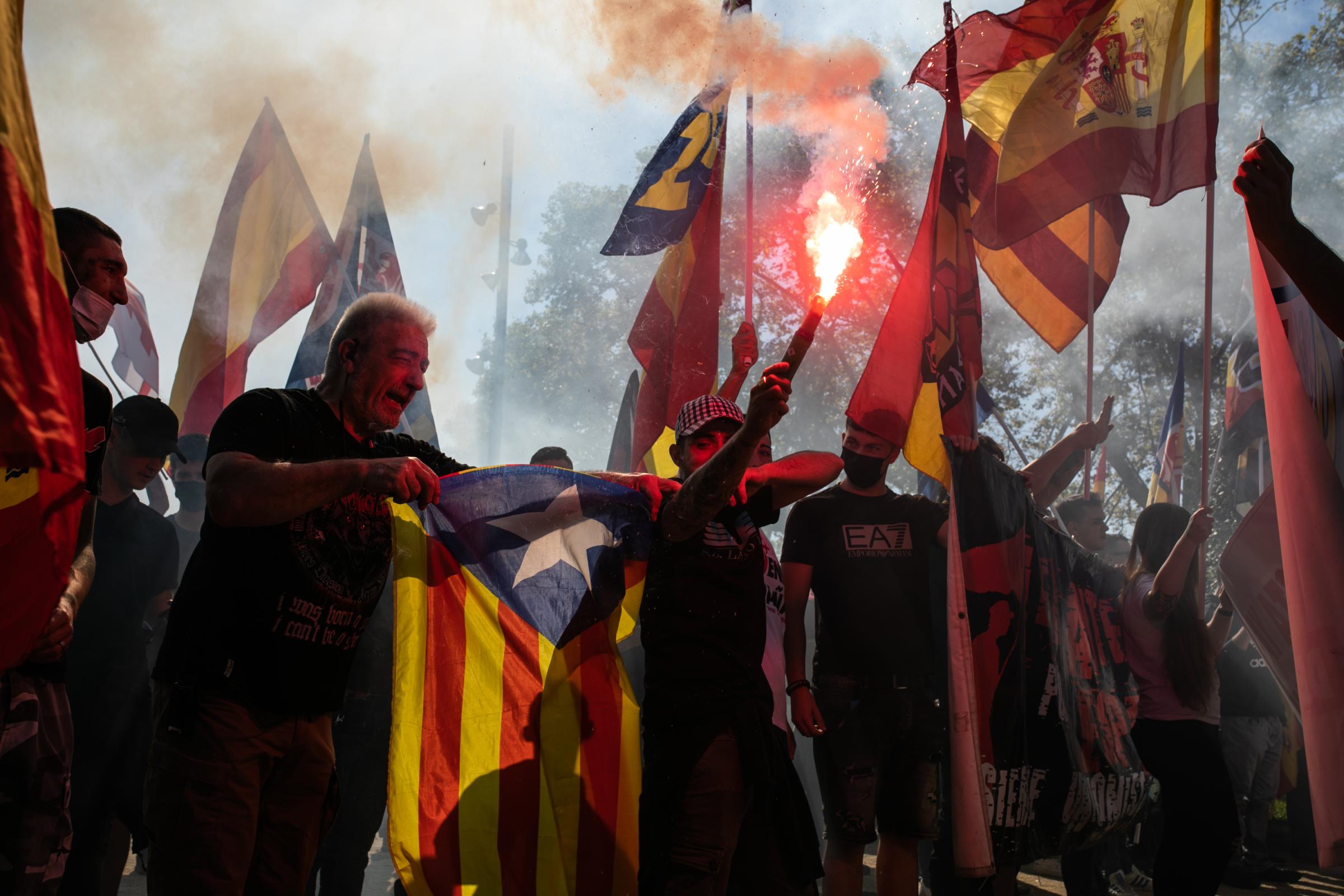 Spain's National Day Overshadowed By Colonialist Past  - BARCELONA, SPAIN - OCTOBER 12: A man burns a...