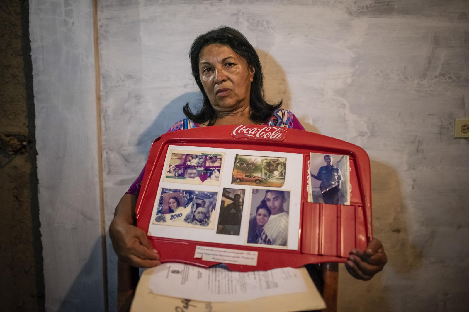 Between violence and justice - The mother of a murdered young man shows a picture with...