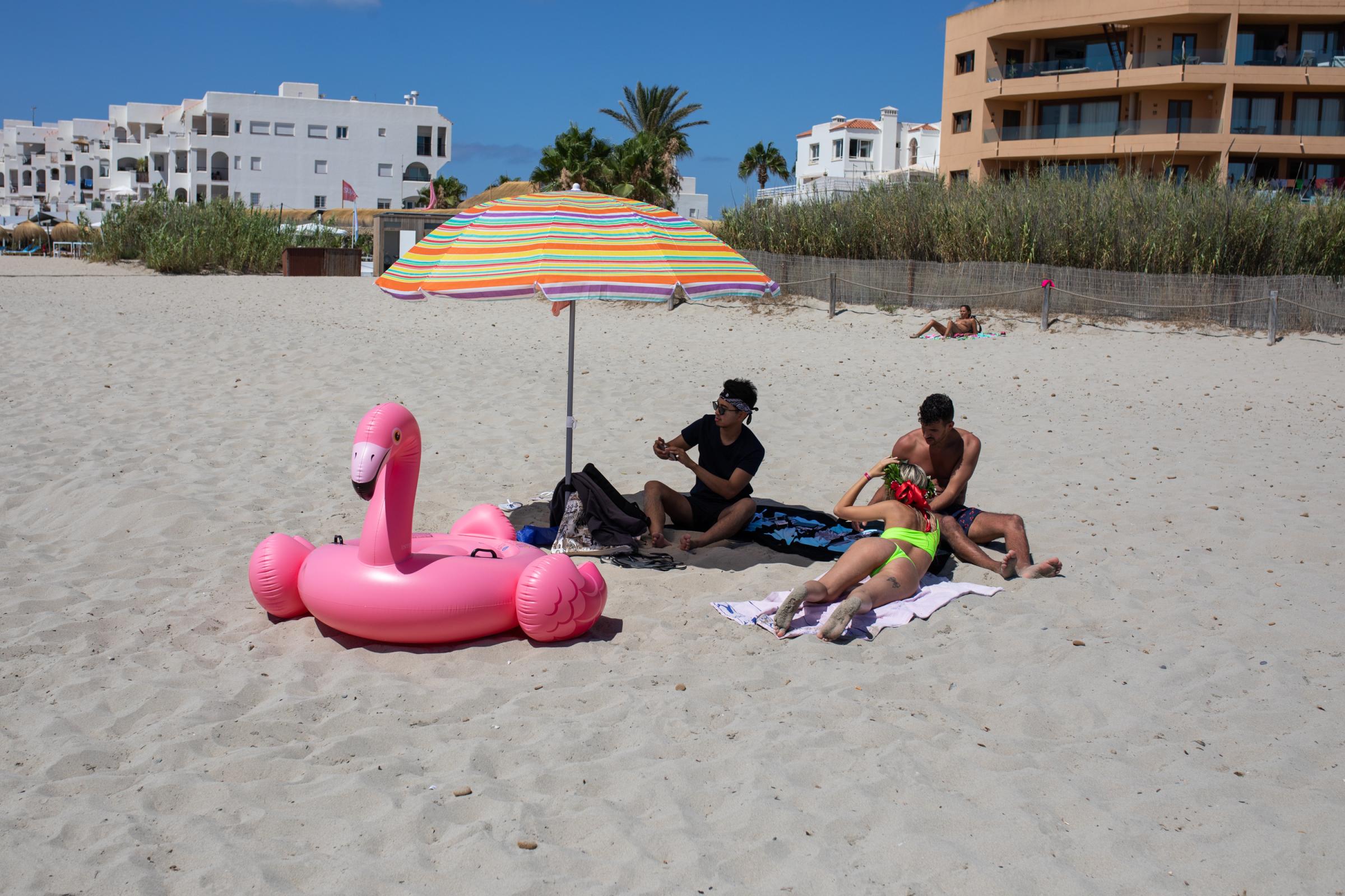 Covid-19: Ibiza Added To UK Amber Travel List - IBIZA, SPAIN - JULY 16: Young unidentified tourists enjoy...