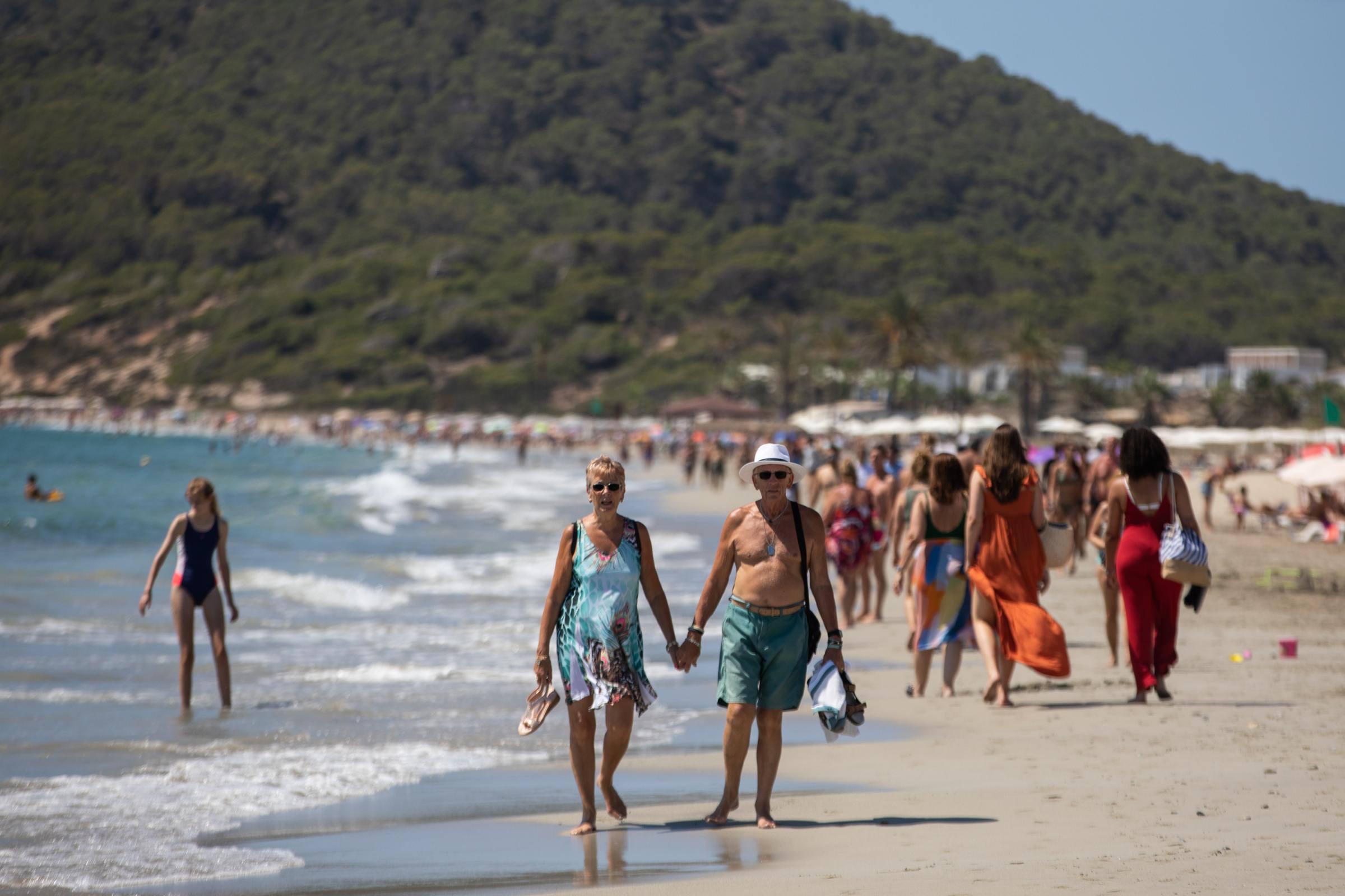 Covid-19: Ibiza Added To UK Amber Travel List - IBIZA, SPAIN - JULY 16: Unidentified elderly people walk...
