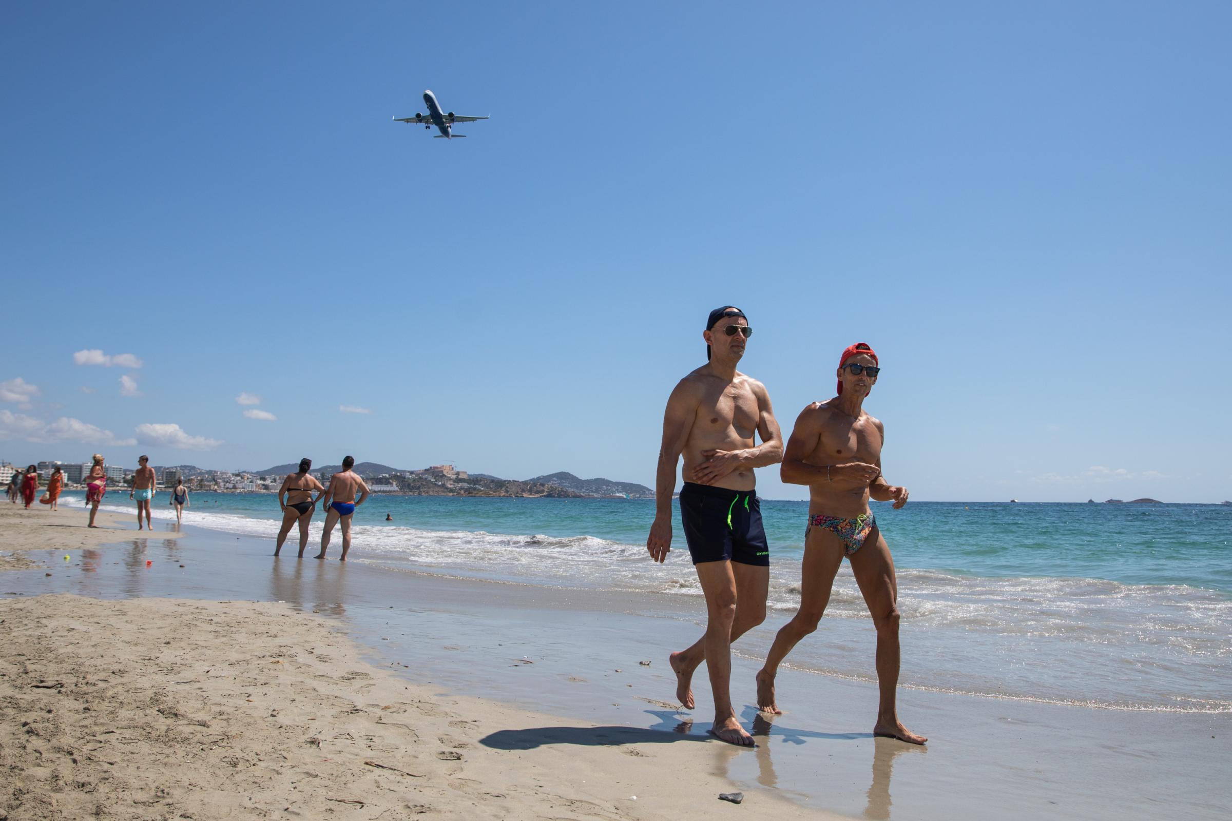 Covid-19: Ibiza Added To UK Amber Travel List - IBIZA, SPAIN - JULY 16: Unidentified tourists stroll...