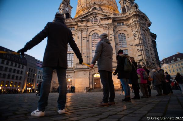 DRESDEN, GERMANY-FEBRUARY 13: People gathered to make the human chain of rememberance outside the Frauenkirche in the Altmarkt in Dresden, Saxony, Germany on the 13th of February 2022. Today is the 77th anniversary of the Allied bombing of the city during the Second World War and 3000 people gathered to make a spacially distanced Corona safe act of rememberance by forming a human chain from Dresden Altmarkt via Wilsdruffer Strasse to the Neumarkt.(Photo by Craig Stennett/Getty Images)