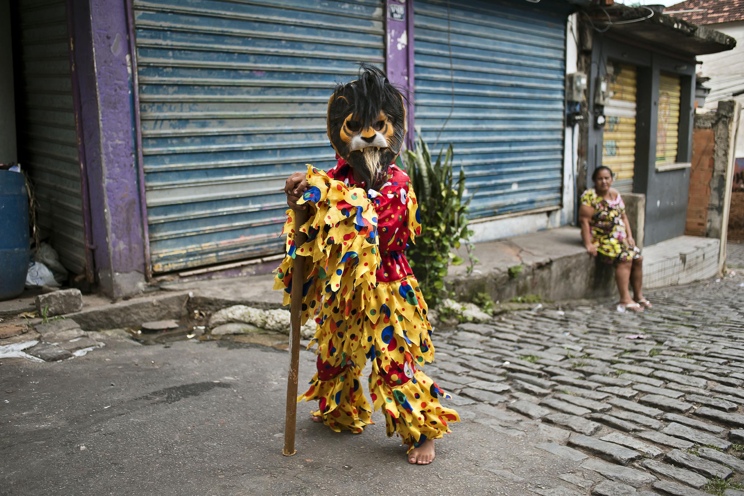 Folia de Reis - BRAZIL / Rio de Janeiro / Rio de Janeiro Theo is standing in an alley of the favela Santa Marta,...