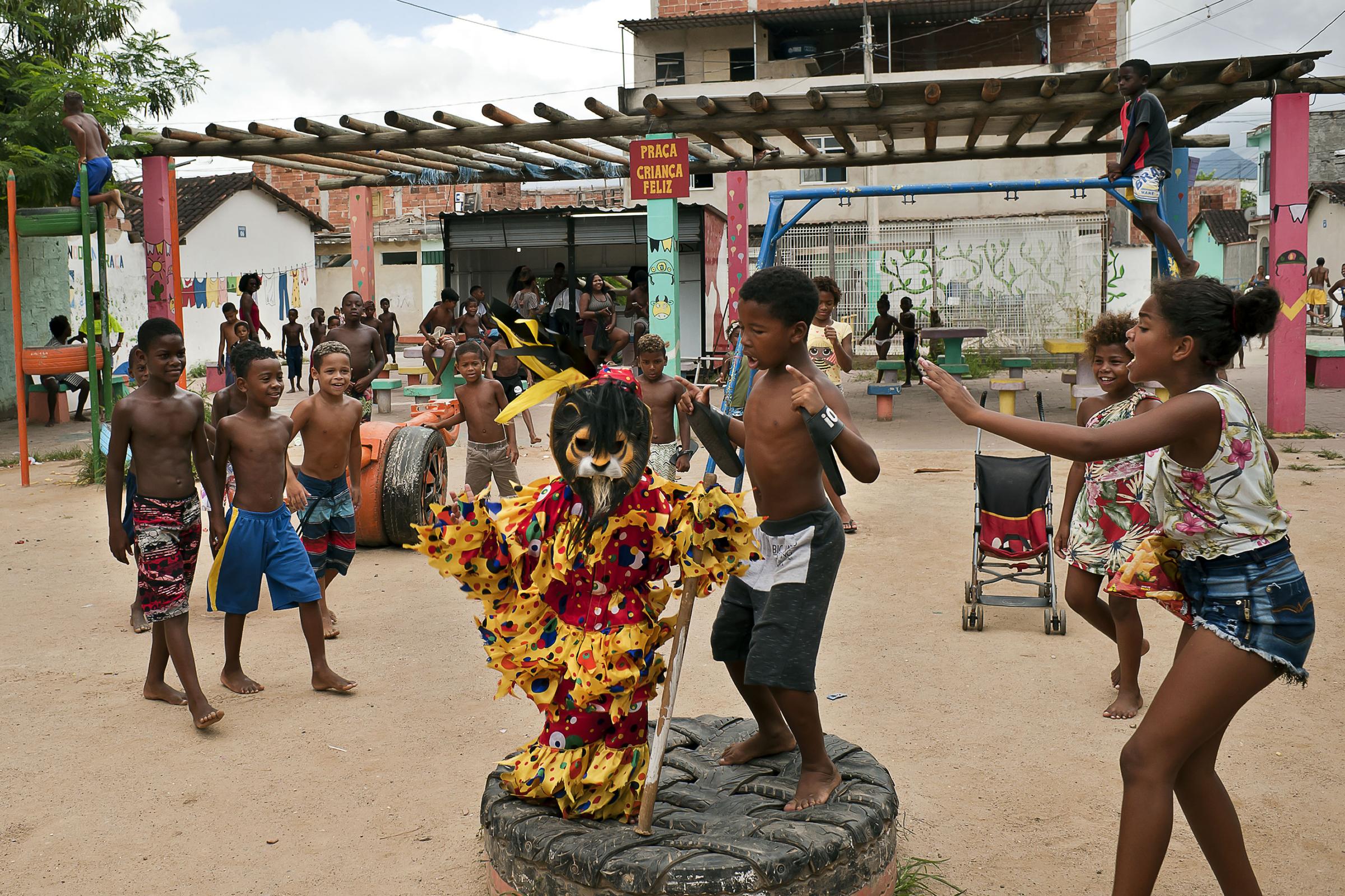 Folia de Reis - BRAZIL / Rio de Janeiro / Rio de Janeiro Theo is playing with other children in the square...