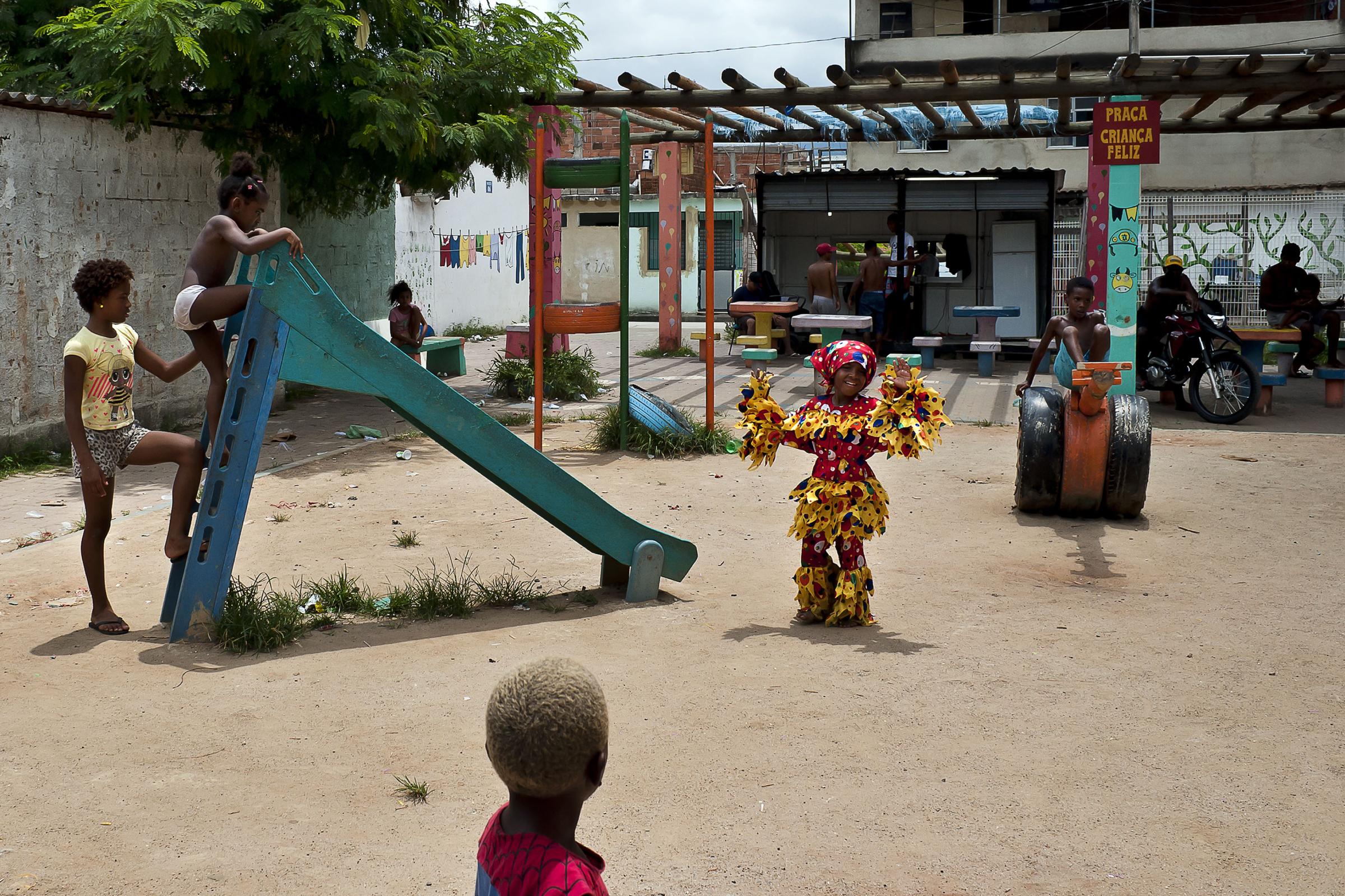 Folia de Reis - BRAZIL / Rio de Janeiro / Rio de Janeiro Theo is playing with other children in the square...