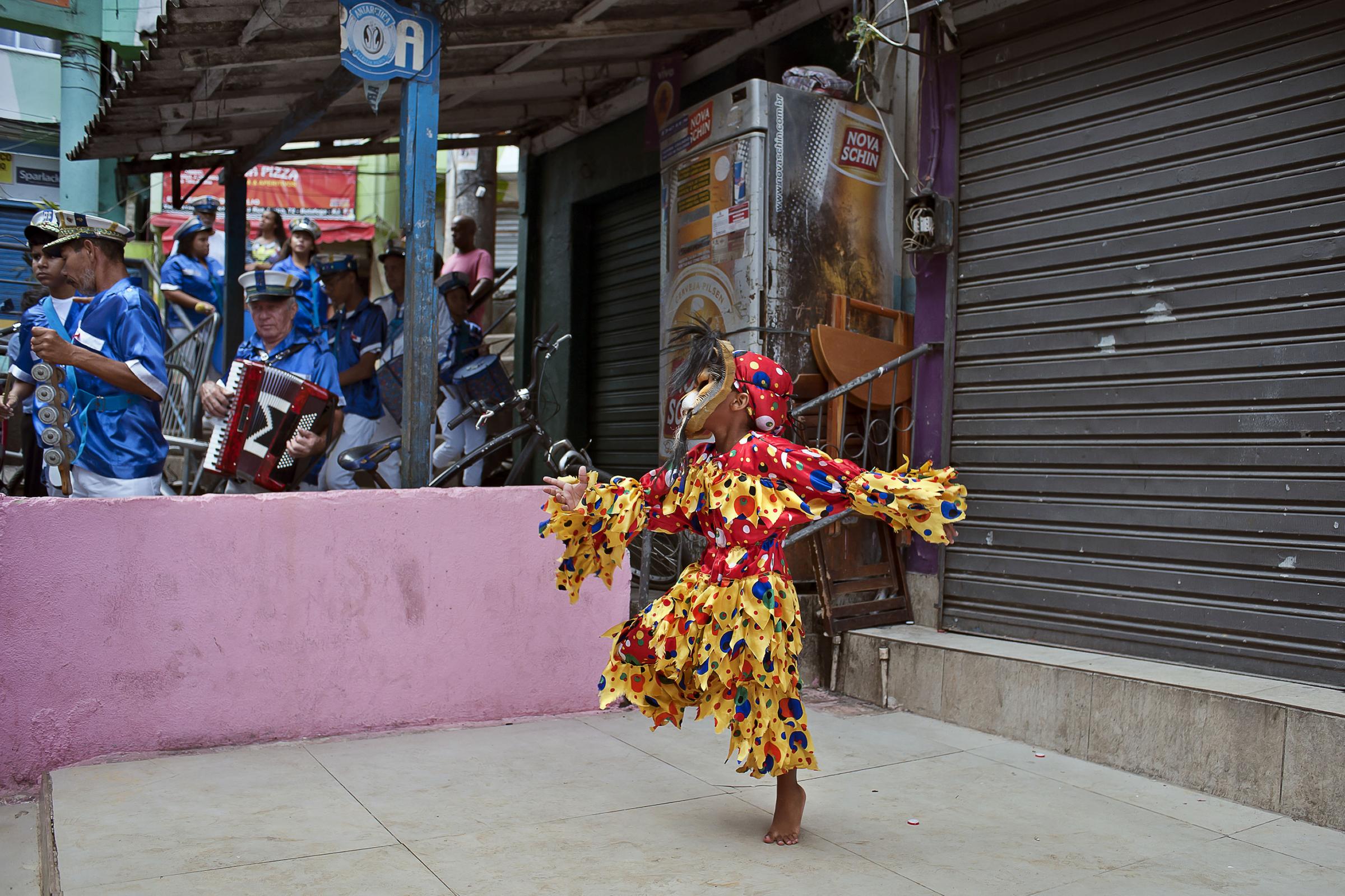 Folia de Reis - BRAZIL / Rio de Janeiro / Rio de Janeiro Theo is dancing in the favela Santa Marta, in the Zona...