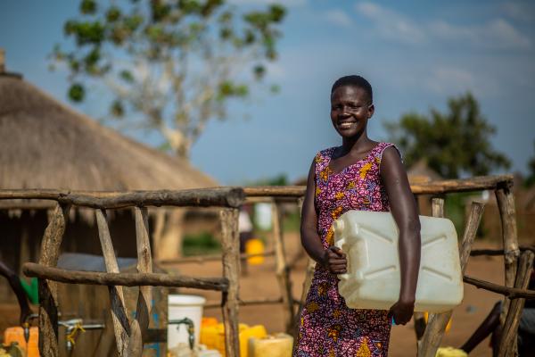 Image from Photography - A portrait of Joycelyne at the community borehole where...