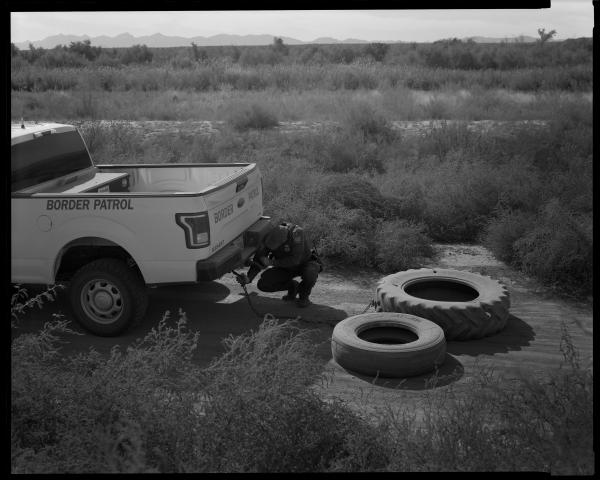 Border Patrol, West Texas, 2020  Border Patrol drags tires in the dirt along the border to be able to clearly see footprints.