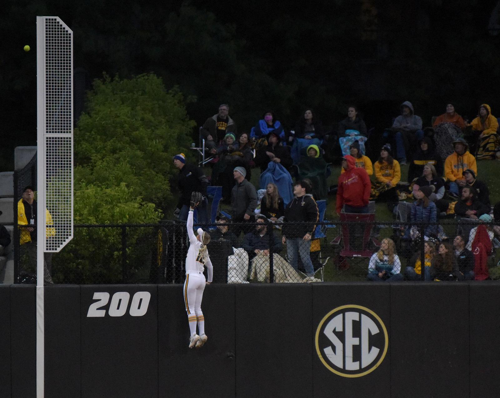 Casidy Chaumont jumps for the ball on Friday, May 28, 2021 at the Mizzou Softball Stadium in Columbia. There was a record breaking 2,632 fans in attendance for the game.
