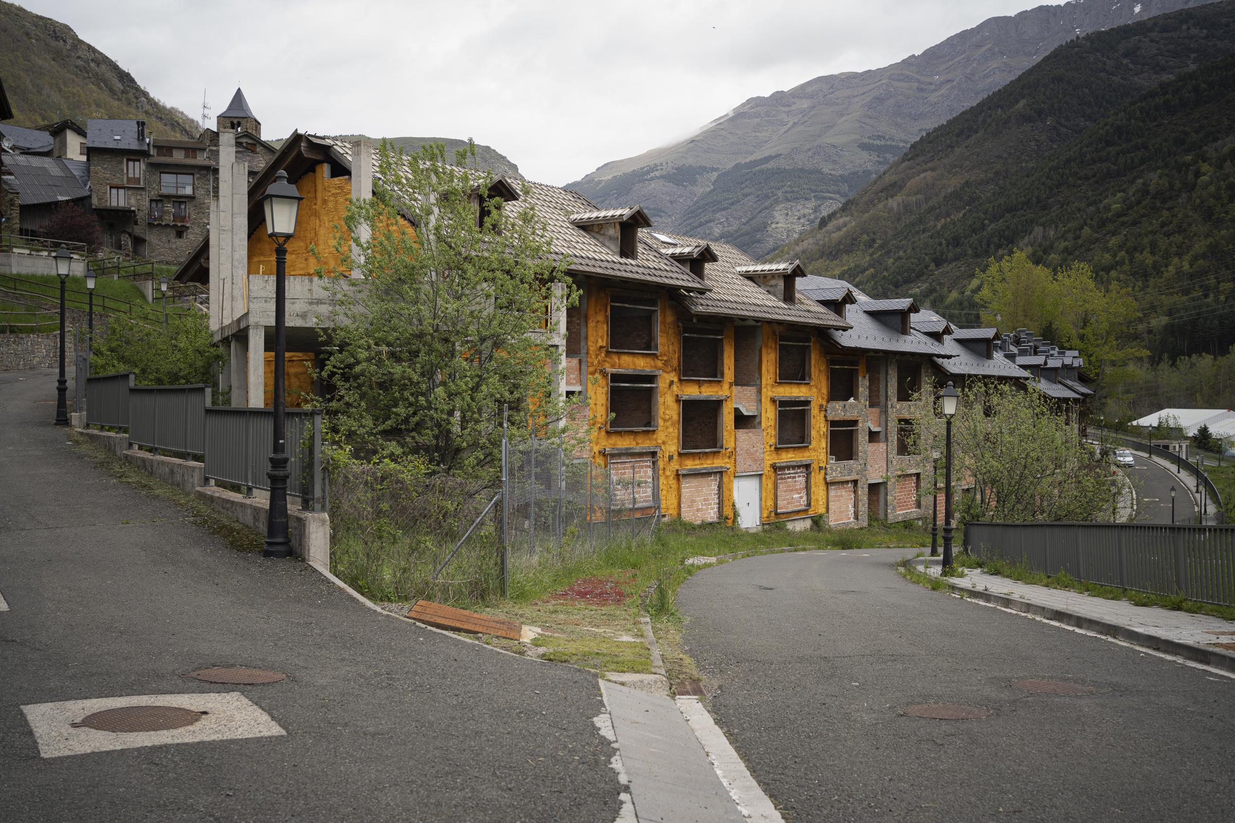  Half-built abandoned flats in the first row of houses in the village of Espui. The village,...