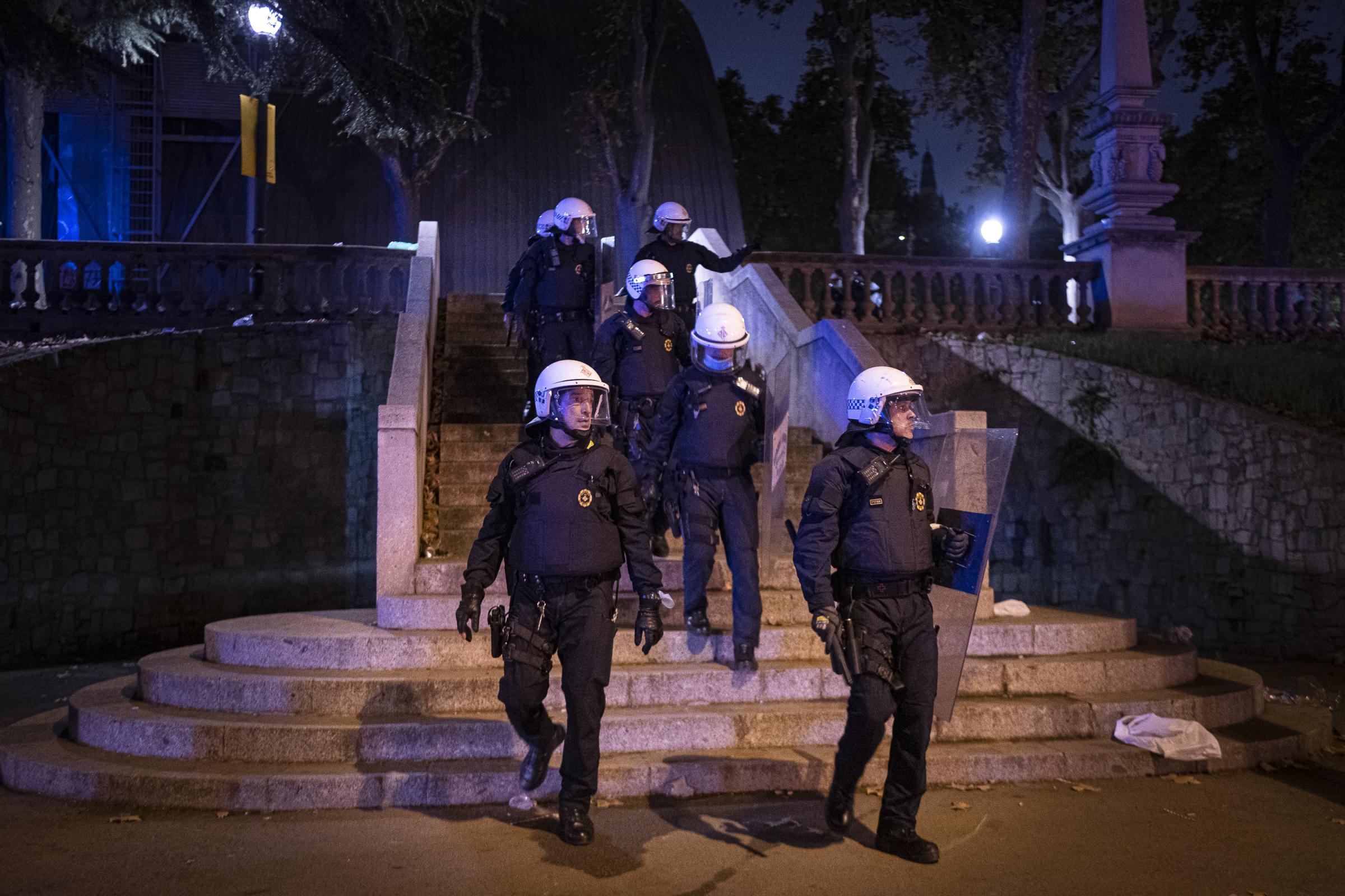 Anti-riot officers of the UREP of the Gu&agrave;rdia Urbana go down some stairs near the...