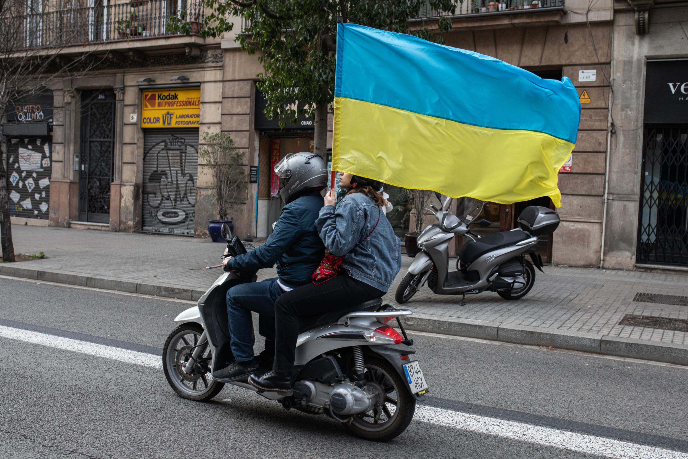 Protestors In Spain Rally For Ukraine After Russian Invasion - BARCELONA, SPAIN - FEBRUARY 26: A person carries a...