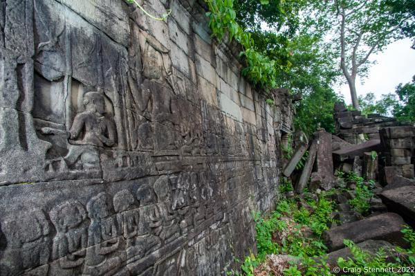 BANTEAY CHHMAR. CAMBODIA-MAY 26: Some standing walls with Khmer carved inscriptions at the collapsed Bas Relief at Banteay Chhmar Temple, Banteay Meanchey, Cambodia on May 22, 2012. The stone carvings invariably depicted scenes from the daily life, war between Khmer and Chams, religious events, churning of the sea of milk and local fighting. Banteay Chhmar, meaning 'The Citadel of the Cats' was built by Khmer King Jayavarman 7th (1181-1219) in the 12th Century.According to the UNESCO world heritage centre the temple is a unique complex of the Angkorian period of structural style. However, the temple complex due to its geographical isolation with the effects of time and the elements is slowly crumbling and being reclaimed by the surrounding jungle. Teams of Cambodian archeologists and the Global Heritage Fund are mounting a rescue mission in order to stem the temple's continued collapse. (Photo by Craig Stennett/Getty Images)