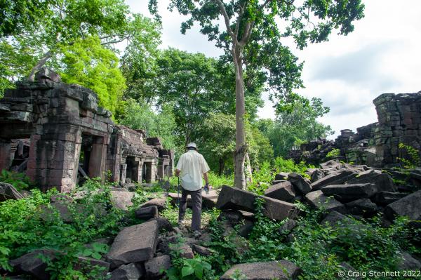 BANTEAY CHHMAR. CAMBODIA-MAY 23: Bitish architect John Sanday (OBE) walks through the ruins of Banteay Chhmar Temple, Banteay Meanchey, Cambodia on May 23, 2022. The temple of Banteay Chhmar, meaning 'The Citadel of the Cats' was built by Khmer King Jayavarman 7th (1181-1219) in the 12th Century. According to the UNESCO world heritage centre the temple is a unique complex of the Angkorian period of structural style. However, the temple complex through the effects of time and the elements is slowly crumbling back into the jungle. Teams of Cambodian stone masons and archeologists assisted by the Global Heritage Fund and Cambodian government are mounting a rescue mission in order to stem the temple's continued collapse.(Photo by Craig Stennett/Getty Images)