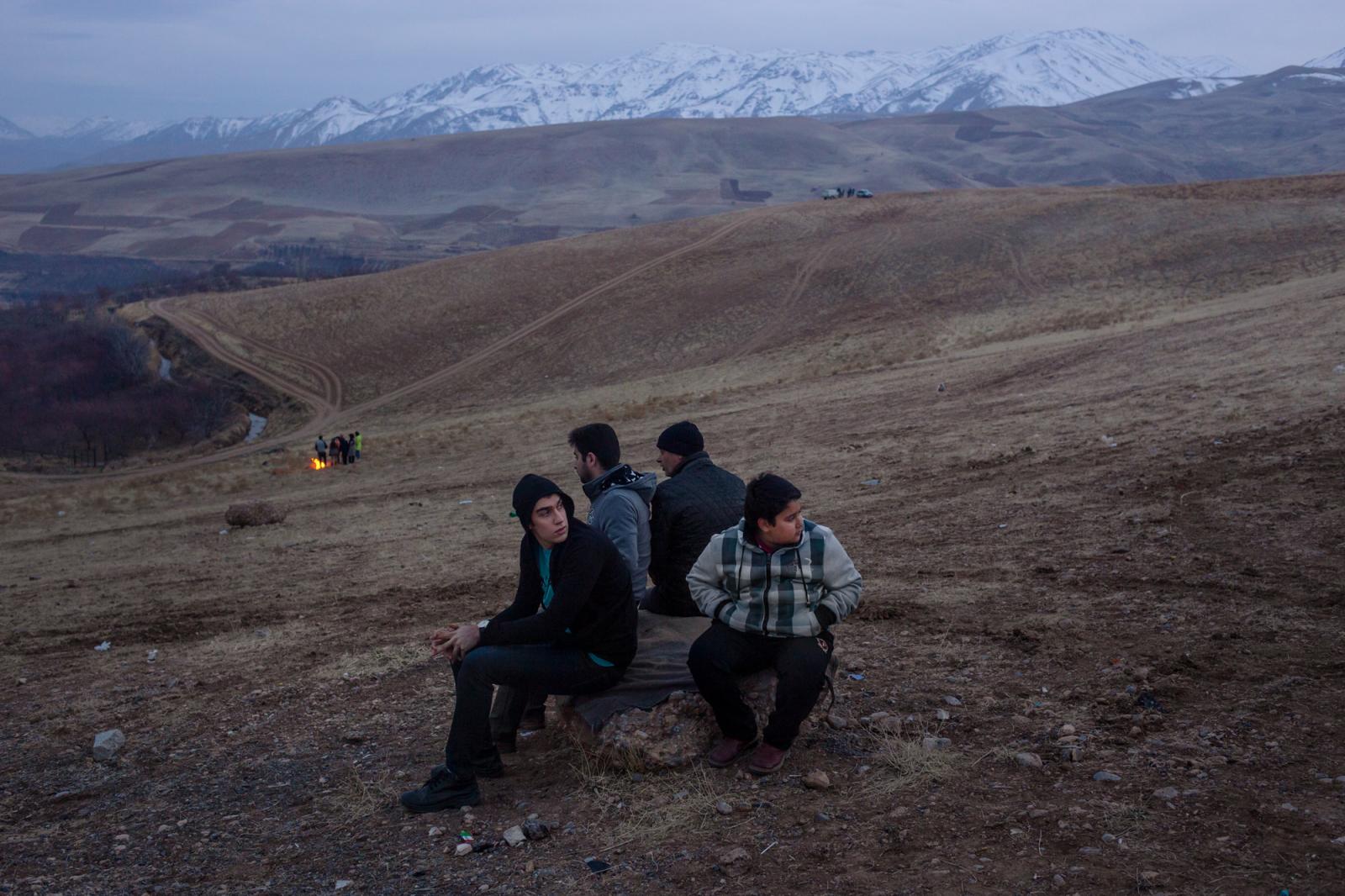 Thumbnail of An Iranian family rest on a rock_, Iran on February 9, 2018. Iran