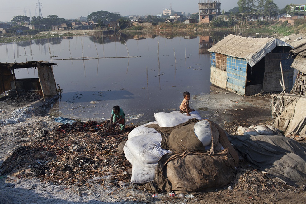 A child sits on the tannery was...op 10 polluted places on earth.