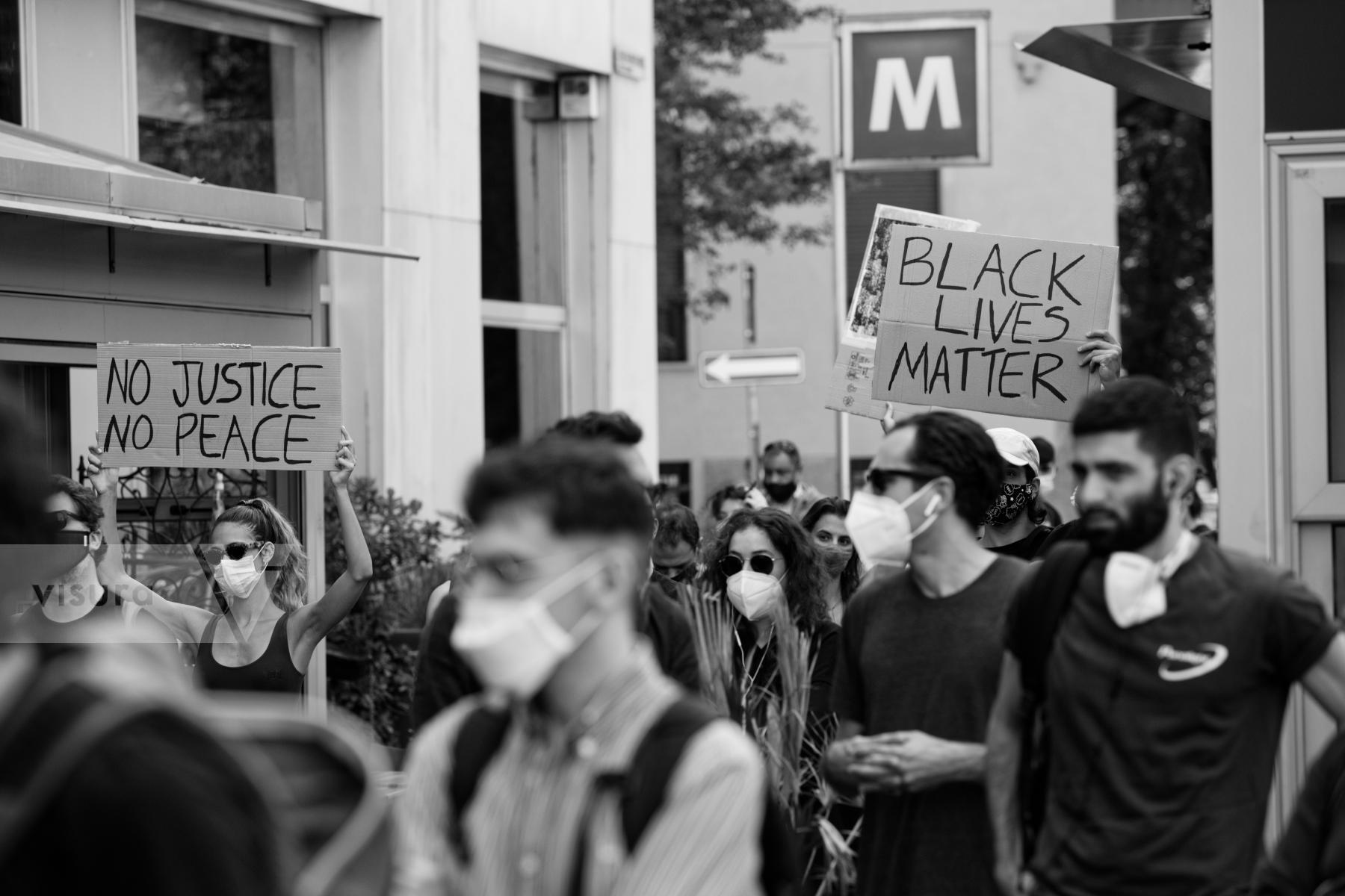 Purchase Demonstrators holding signs by Laura Larmo