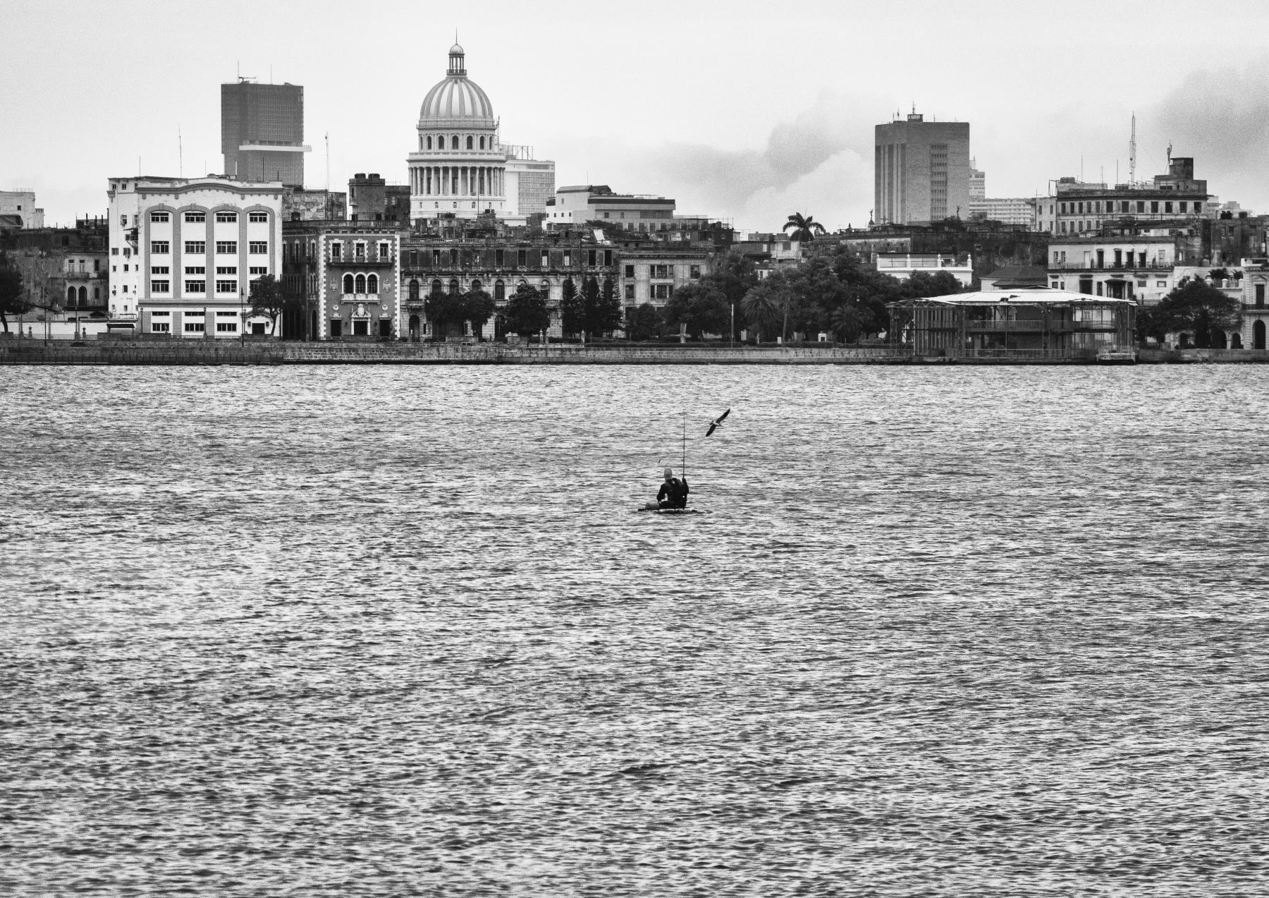 Purchase Fishing in the Havana's bay a few hours before the Rafael hurricane's impact  by Dany del Pino Rodríguez