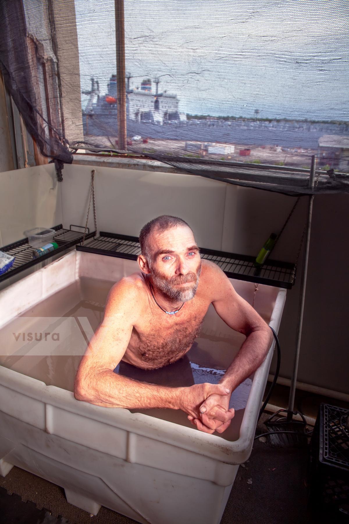 Purchase 220710-7884 Russell relaxing in a tub by Mary Lou Uttermohlen