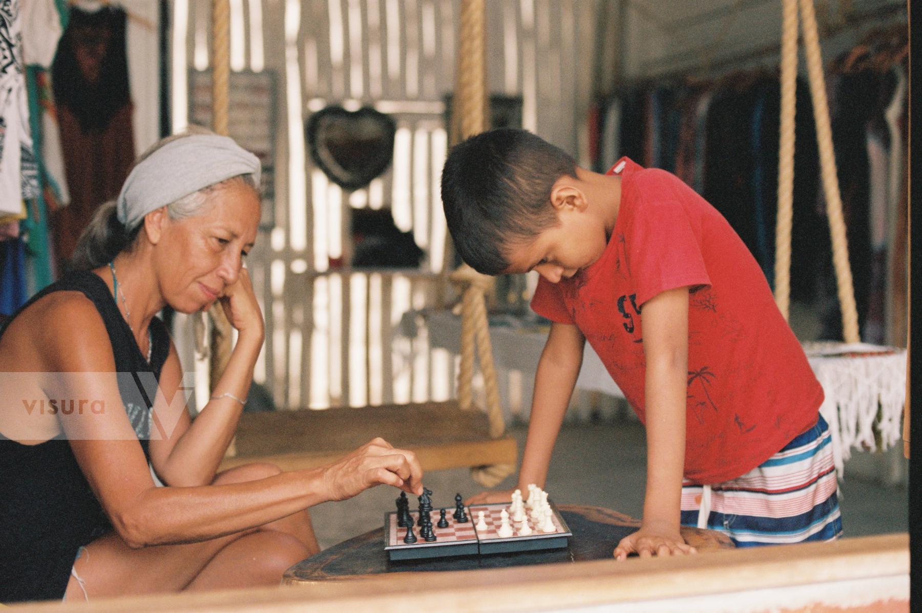 Purchase Mother and Child playing chess  by Hannah Kozak