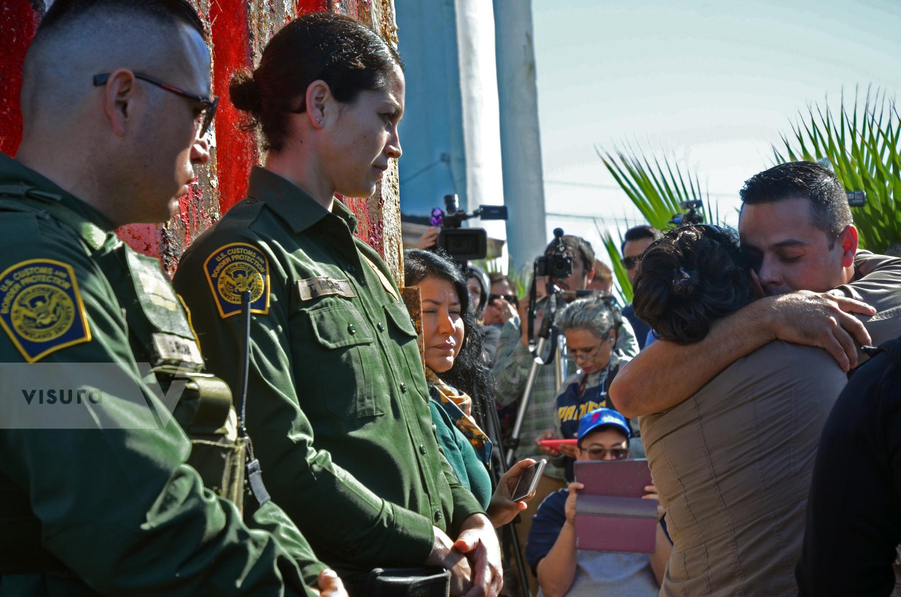 Purchase Deported Families Reunute at the US/ Mexican Border by Tish Lampert