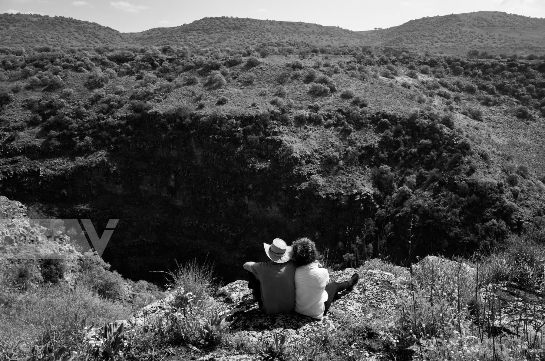 Purchase Couple relaxing in mountains. by Victor Bezrukov