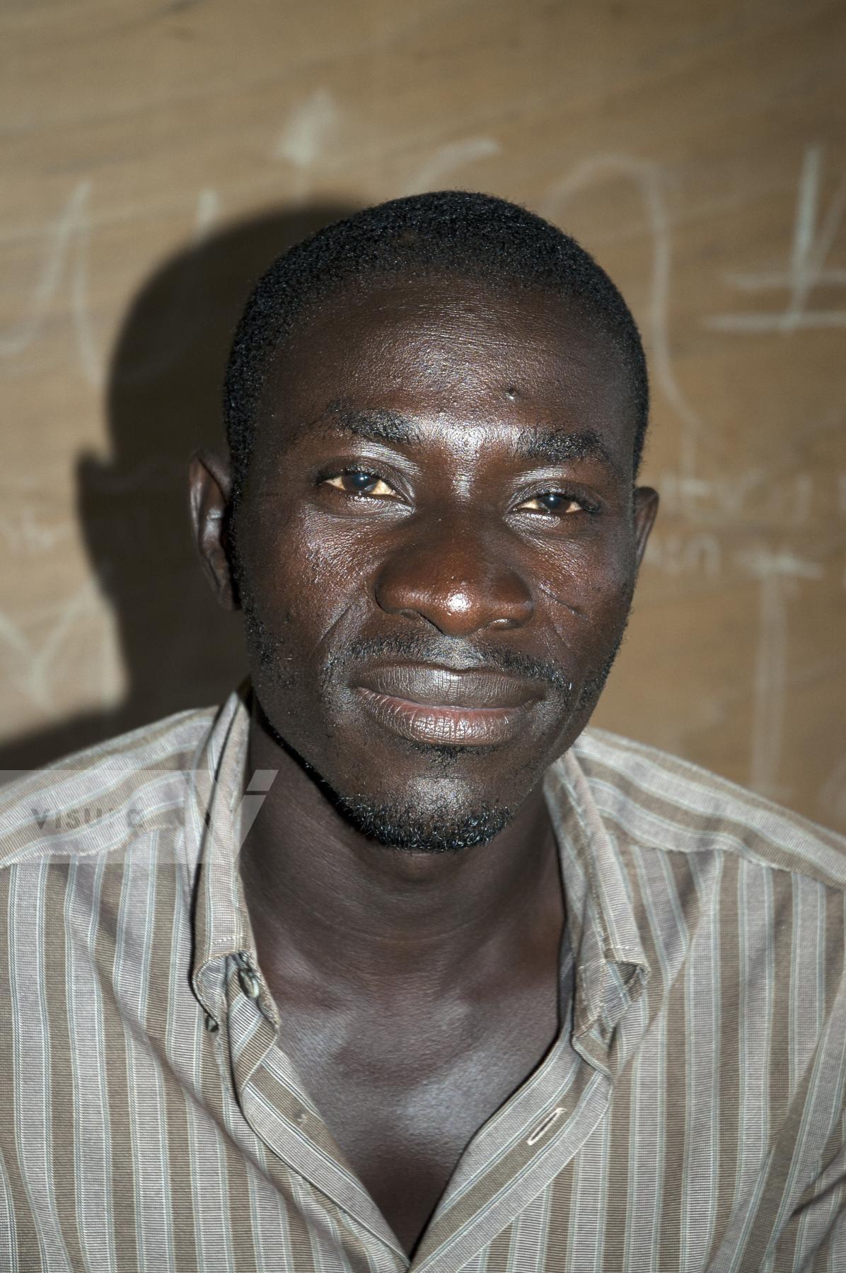 Purchase Portrait of a teacher in Ghana by Tish Lampert