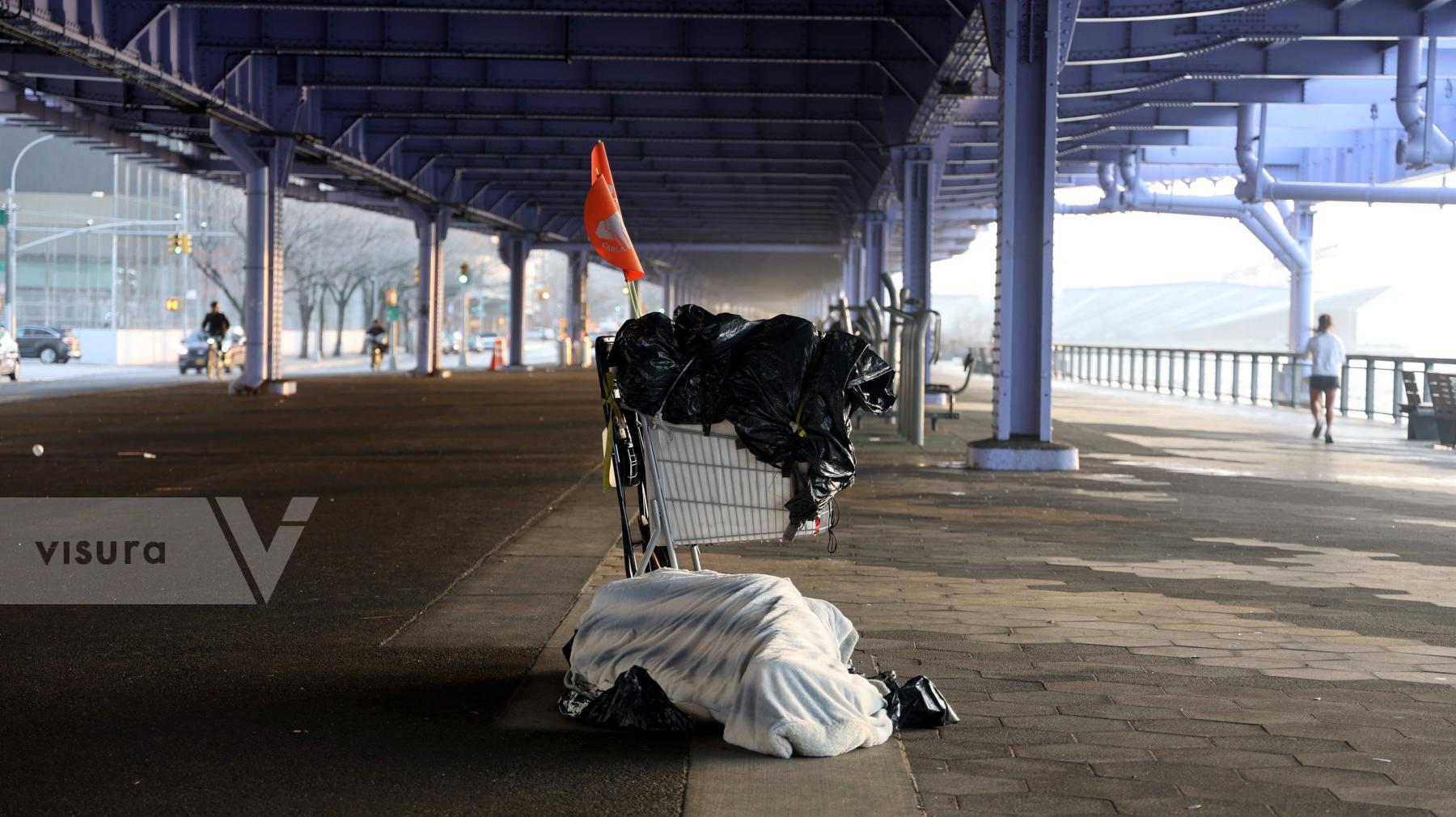 Purchase Homeless person sleeps in the cold by Luiz C. Ribeiro